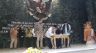 Dhewanto, center, signs a memorandum of understanding with the government of Jakarta, Indonesia, on behalf of her startup, duithape.
