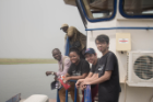 From left, Prince Oduro, executive director of African Rights Initiative International; Evelyn Quist, UB MD/MBA student; Joshua Holmes, a Rochester Institute of Technology student; and UB pharmacy student Ebne Rafi travel by boat to the Afram Plains region in Ghana. Photo: Jordi Owusu