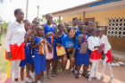 At center, MBA/MPH student Danielle Vazquez created and taught a menstrual health curriculum at a school in Accra, Ghana. The students received health packages donated by the nonprofit Day for Girls International. Photos: Nana Owusua