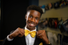 Shelden Gibbs, 8th grader and founder and CEO of Classic Knot, shows off one of his handcrafted bowties. Photo: Douglas Levere