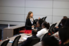 Vanessa Patrick PhD gestures to attendees during her learning track talk. 