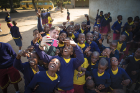 Student Dylan McCaffrey takes a selfie with local schoolchildren.