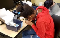 Student assembles a Raspberry Pi computer in GenCyber camp. Read about startups in this issue of Buffalo Business. 