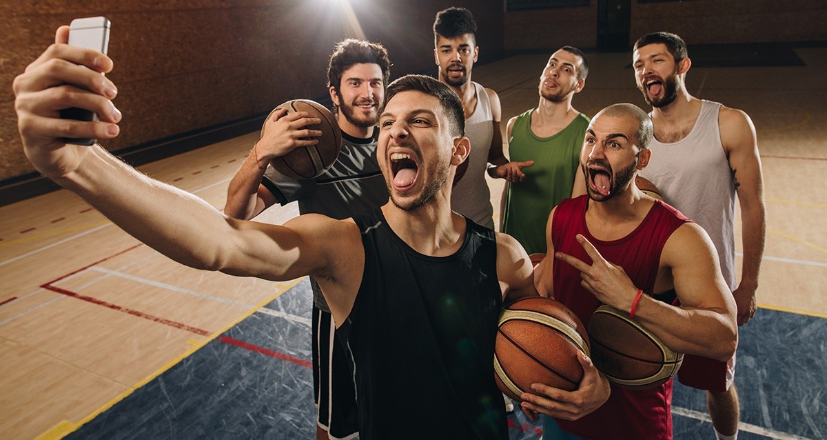 Group of basketball players taking a selfie. 