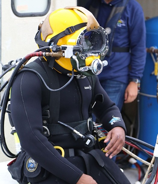 McCulloch preparing to dive, with helmet on. 