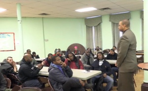 Berry, at right, speaks to participants in Project D.A.D. Access a larger version of this image. 