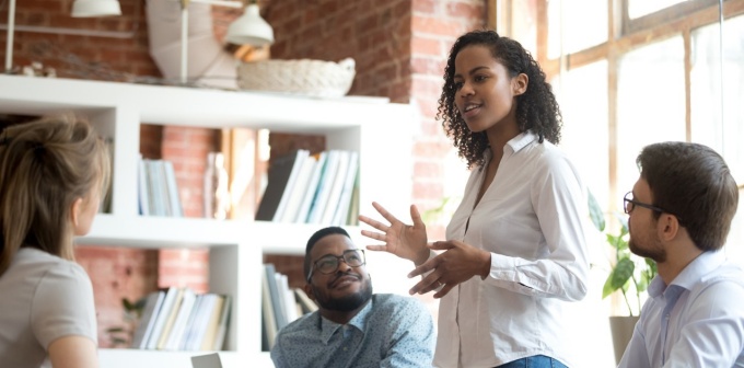 Woman leads a business meeting. 