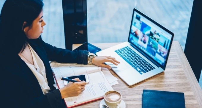 Woman in a video conference call at a coffee shop. 