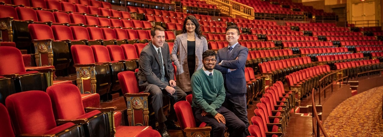 Zoom image: From left, MS Finance students Fernando Lemonje Westrupp, Turya Vardhan, Roshit Badjatiya and Guodong Huang inside the magnificent Shea's Performing Arts Center. (Ashana Dave, who is not pictured, was also on the Shea's team.) Photo: Tom Wolf 