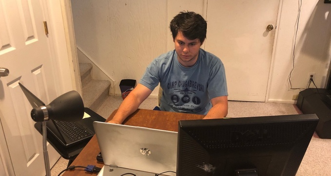 Spector studies in the basement of his home amid the COVID-19 pandemic. 