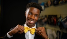 Shelden Gibbs, 8th grader and founder and CEO of Classic Knot, shows off one of his handcrafted bowties. 