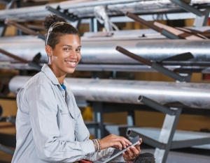 A female manager works in an industrial setting. Access a larger version of this image. 
