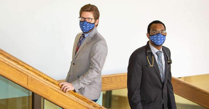 Anders and Ryan pose on a stairway. 