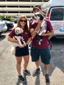 Katrina Jacobi with her husband and dogs at WNYIL's annual Disability Pride Parade. 