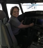 Joanne Rinaldo in a plane's cockpit. 