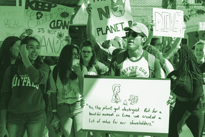 UB students at the 2019 climate strike with protest signs. 