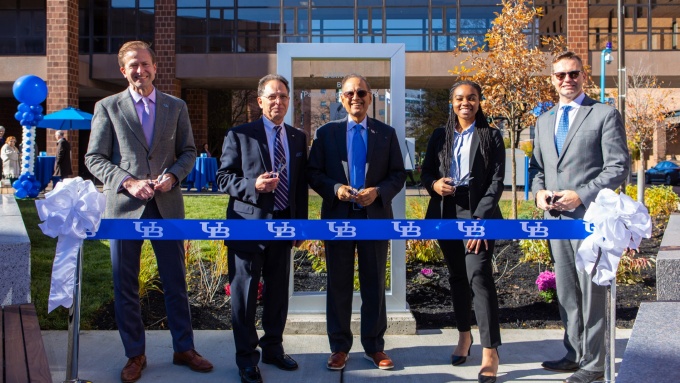 Paul Tesluk, Russ Agrusa, Satish Tripathi, Sydney Merritt and Rod Grabowski cut the ribbon to open Paula Agrusa Plaza. 