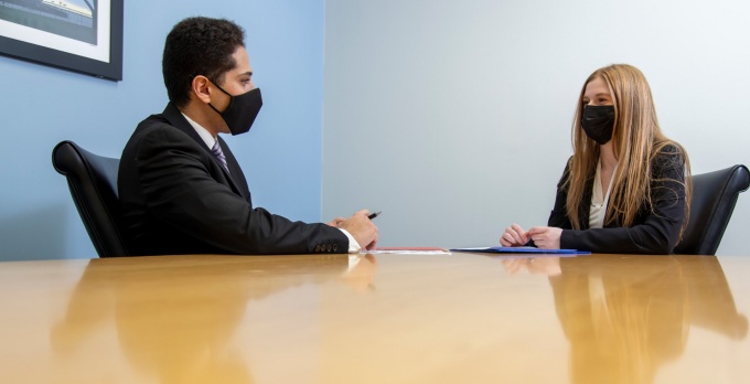 Youssef Allam and Krissy Westmiller practice their interview skills. 