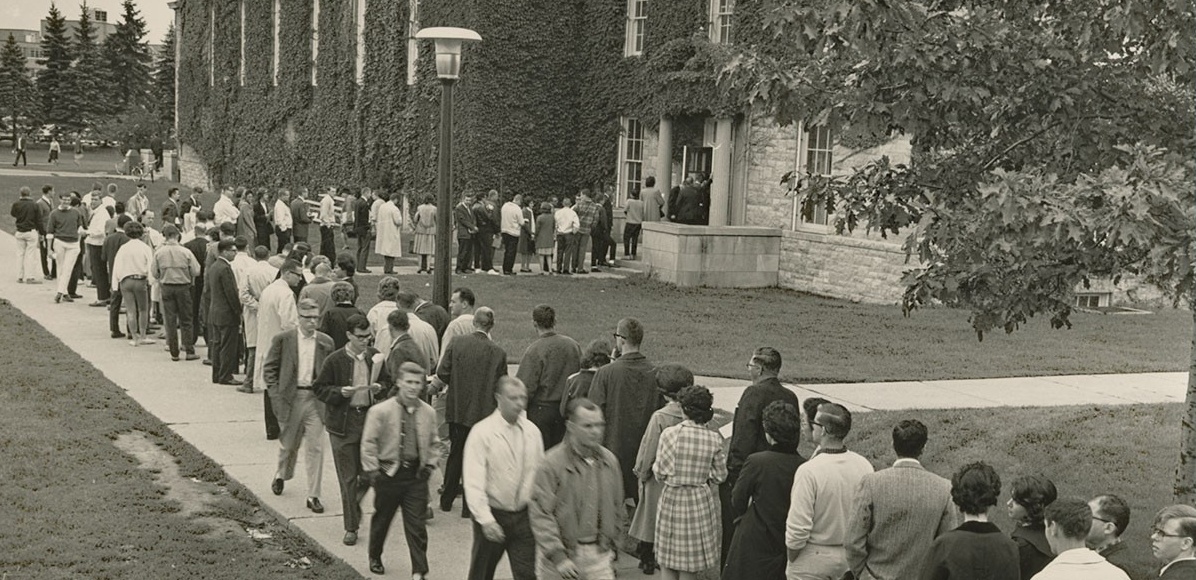 Students line up to register for classes outside Clark Hall in 1963. 