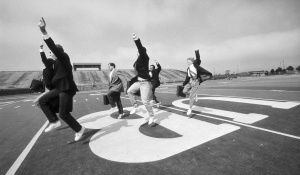 The Precision Briefcase Drill Team practice their routine on the field in UB Stadium. 