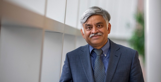 Ananth Iyer by the windows in Alfiero Center. 