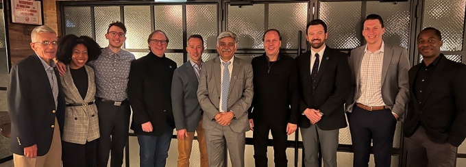 Alumni with Dean Iyer. 