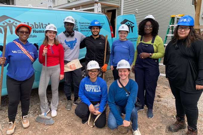 Nonprofit board fellows volunteering at Habitat for Humanity. 