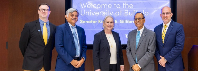 Gillibrand with university leaders. 