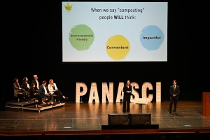 Panasci team presenting on stage in front of judges. 