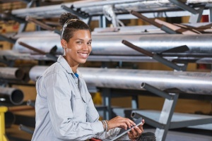 Person in warehouse using a tablet. 