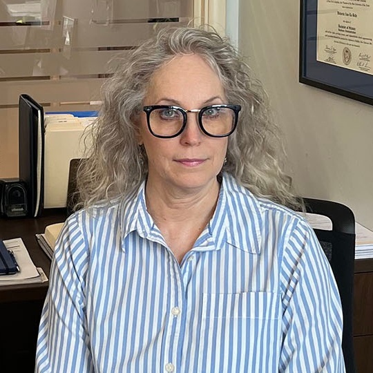Zoom image: Vicky LaBelle, BS ’00, in her office at Benderson Development, where she serves as director of human resources. 