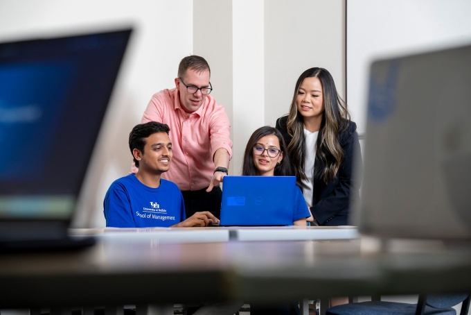 Professors Michael Krupski and Cassie Nguyen with graduate students Abhishek Harihar and Kavita Pant in the Projects Clinic space in Alfiero Center. 
