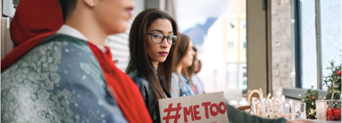 Lady holding a Me Too placard. 
