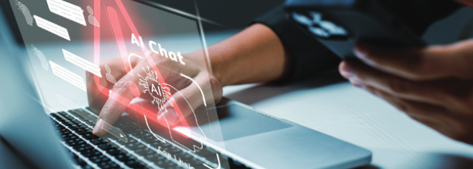 Laptop with a red traingle warning sign projected as a hologram with the words "AI Chat" across the screen. 
