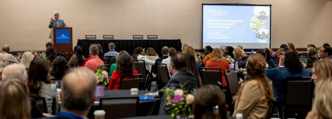 Dean Iyer addresses attendees at the conference. 