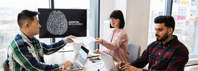 Individuals having a team discussion in a work office. 