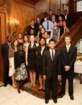 Students standing on staircase. 