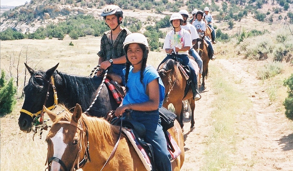 Students riding horses at Paintrock campsite. 