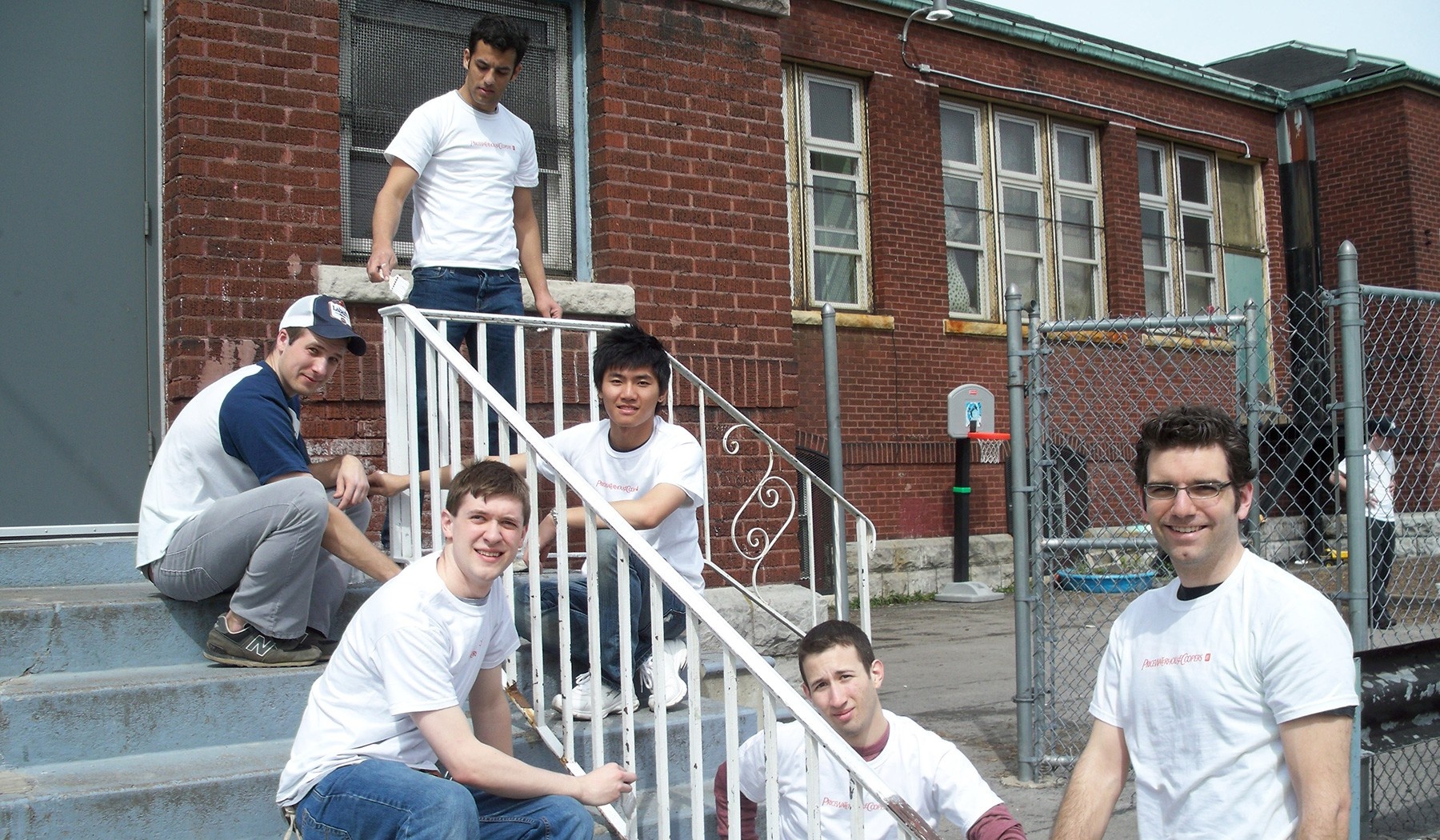 Students repainting staircase railing. 