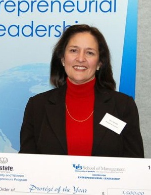 Marie Battaglia holding a winner's check. 