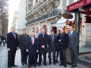 14 UB School of Management PMBA Students standing in a street in Paris. 