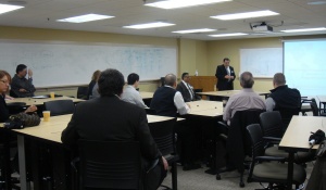 Industry leaders, faculty and staff seated at presentation and interactive session in new GSSM Lab. 