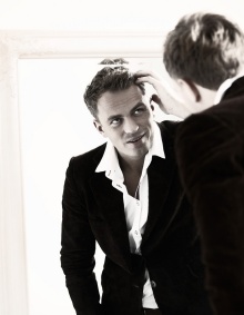 Man looking at himself in the mirror. 