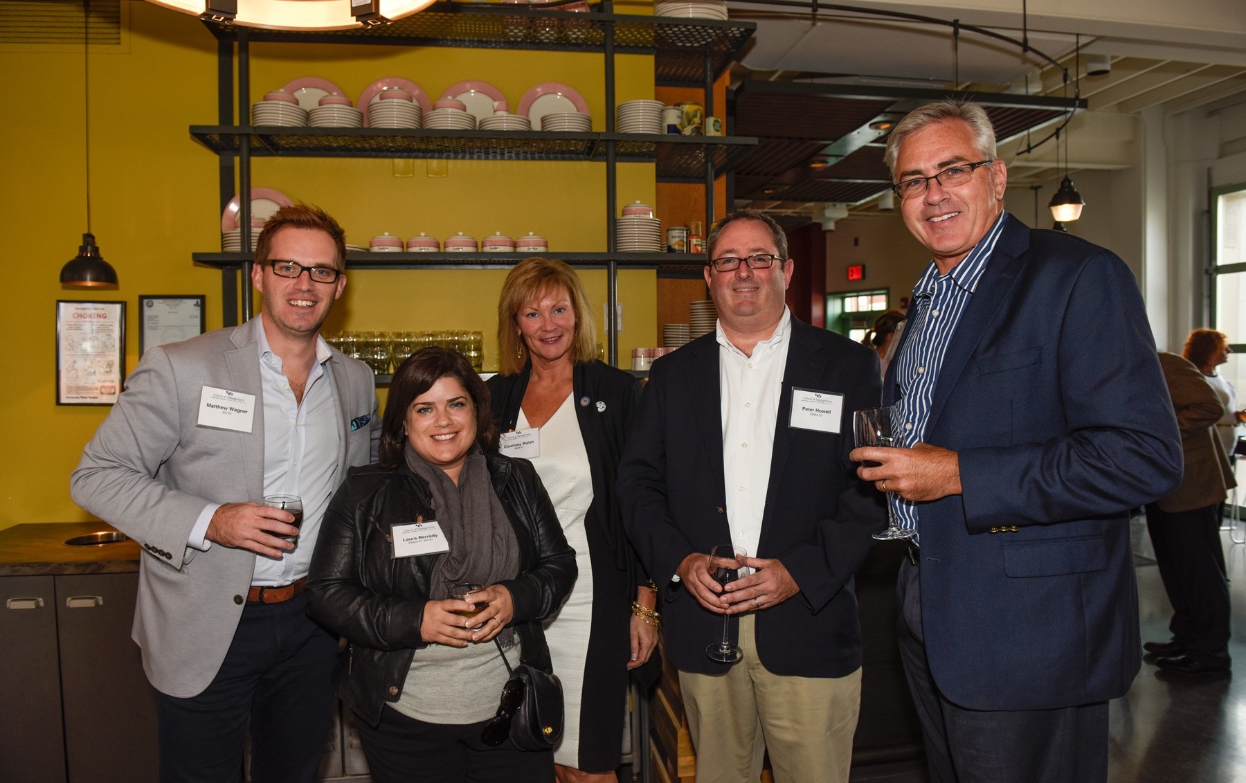 Zoom image: From left: Matt Wagner, BS '03; Laura Berrady, EMBA '07, BS '97; Courtney Walsh, MBA '01; Peter Howell, EMBA '07; and Dan Penberthy, EMBA '00. 