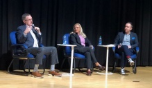 Presenters on stage at the Eastern Great Lakes Analytics Conference. 