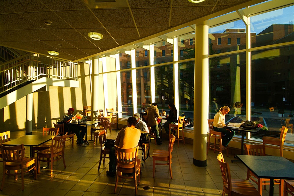 View of seating area in cafe. 