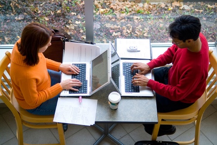 Overhead view of students working outside of cafe. 