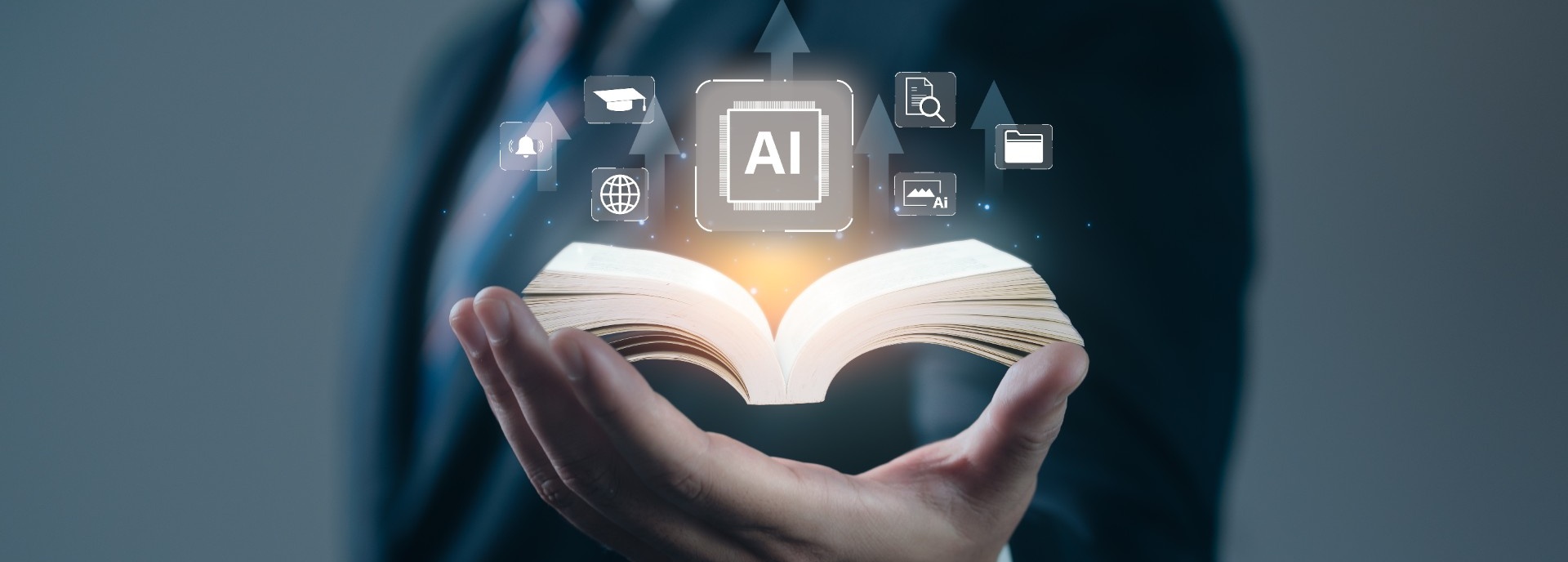 Person in a dark suit holding a book with AI icons emerging from it. 