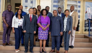 Suresh and Siaw-Asamoah with UPSA deans, directors and faculty at the signing ceremony. 