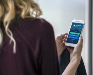 Woman using the Ognomy app. 